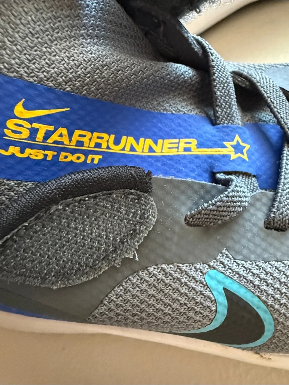 Nike Kids Gray Sneakers with Blue Accents